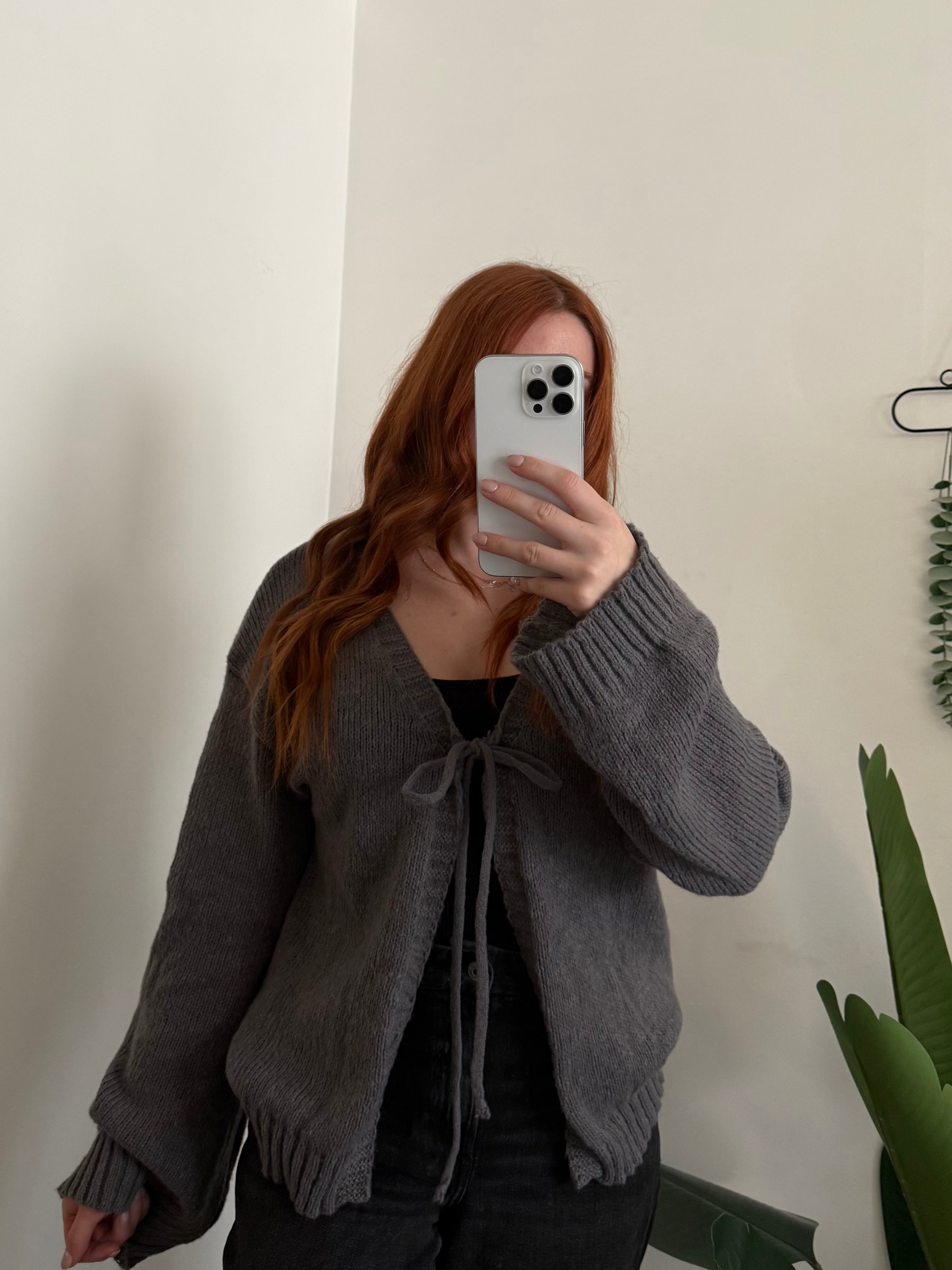 Add a cozy-chic touch to your look with the Tie-Front Dropped Shoulder Cardigan. Featuring a relaxed fit and dropped shoulders for an effortlessly laid-back vibe, this cardigan ties at the front for a flattering, feminine finish.

Made from soft, comfortable fabric, it’s perfect for layering over tanks, tees, or dresses.

✨ Simple, stylish, and versatile — your go-to cardigan for effortless everyday layering.

Features:Tied
Stretch:Slightly stretchy
Material composition:100% polyester
Care instructions:Mach