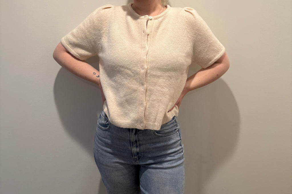 soft knit short sleeve cardigan, ivory knit button top, minimalist women’s sweater, boutique knitwear 2025, puff sleeve knit top, lightweight cardigan for women, elegant knit button tee, feminine minimalist clothing